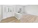 Bright foyer with a decorative glass door, wood-look floors, and neutral decor at 6107 Misty Oaks St, Sarasota, FL 34243