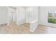 Open foyer featuring wood-look flooring, a window, and a decorative front door at 6107 Misty Oaks St, Sarasota, FL 34243