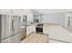 Stylish kitchen showcases stainless steel appliances, light countertops, and sleek cabinetry at 6107 Misty Oaks St, Sarasota, FL 34243