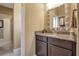 Bathroom featuring dark wood cabinets and stylish mirror at 6302 Anise Dr, Sarasota, FL 34238