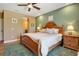 Bright bedroom featuring neutral walls, light wood floors, and wood furniture at 6302 Anise Dr, Sarasota, FL 34238