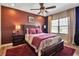 Bedroom features a ceiling fan, wood floors, and a large window at 6302 Anise Dr, Sarasota, FL 34238