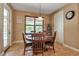 Cozy breakfast nook with natural light, a round table, and seating for four, ideal for casual dining at 6302 Anise Dr, Sarasota, FL 34238