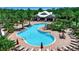 Aerial view of the neighborhood community pool, lounge seating, umbrellas and well manicured grounds at 6302 Anise Dr, Sarasota, FL 34238