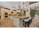Gourmet kitchen features a large island, custom cabinets, and stainless steel appliances at 6302 Anise Dr, Sarasota, FL 34238