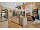 Modern kitchen featuring a large island, stainless steel appliances, and an open floor plan to the living area at 6302 Anise Dr, Sarasota, FL 34238