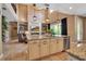 Stylish kitchen with a center island, stone countertops, and modern appliances at 6302 Anise Dr, Sarasota, FL 34238