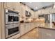 Close up of the kitchen with stainless steel double ovens and gas cooktop at 6302 Anise Dr, Sarasota, FL 34238