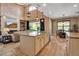 Bright kitchen with an island, bar stool seating, and stainless steel appliances at 6302 Anise Dr, Sarasota, FL 34238