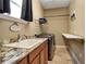 Functional laundry room with modern washer and dryer, granite countertop, and ample storage space at 6302 Anise Dr, Sarasota, FL 34238