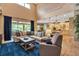 Bright living room with high ceilings, opens to the backyard and features a neutral color palette at 6302 Anise Dr, Sarasota, FL 34238