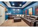 Comfortable living room with a large sectional, colorful walls, and soft carpet at 6302 Anise Dr, Sarasota, FL 34238