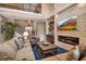 Open living room featuring a fireplace, high ceilings, and comfortable furnishings at 6302 Anise Dr, Sarasota, FL 34238