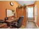 Office features a sauna, an organized whiteboard, a sleek desk, and wood flooring at 6302 Anise Dr, Sarasota, FL 34238