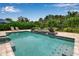 This pool features a jacuzzi with planters and easy-access steps, perfect for Gathering fun at 6302 Anise Dr, Sarasota, FL 34238