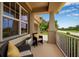 Inviting porch features cozy seating, neutral decor, and a relaxing outdoor ambiance at 6302 Anise Dr, Sarasota, FL 34238