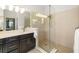 Bright bathroom with a glass shower enclosure, modern fixtures, and ample counter space at 650 Rosemary Cir, Bradenton, FL 34212