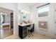 Well-lit bathroom vanity area with a makeup station, stylish mirror, and modern decor at 650 Rosemary Cir, Bradenton, FL 34212