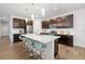 Spacious kitchen with a large island, dark cabinetry, and stainless steel appliances at 650 Rosemary Cir, Bradenton, FL 34212