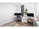 Modern office space with two workstations, featuring sleek desks and comfortable chairs. Neutral color palette at 650 Rosemary Cir, Bradenton, FL 34212