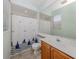 Well-lit bathroom with a toilet and cabinet and shower featuring nautical designed shower curtain at 673 Crane Prairie Way, Osprey, FL 34229