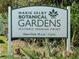 Marie Selby Botanical Gardens Historic Spanish Point welcome sign with opening hours at 673 Crane Prairie Way, Osprey, FL 34229