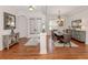 Dining room with hardwood floors, natural light from the windows and modern decorations at 673 Crane Prairie Way, Osprey, FL 34229