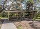 Covered community picnic area with multiple tables and an outdoor grill for Gathering gatherings and barbecues at 673 Crane Prairie Way, Osprey, FL 34229