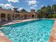 Community pool with sparkling water and comfortable seating areas for residents to relax and enjoy at 673 Crane Prairie Way, Osprey, FL 34229
