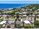 Lovely aerial view of home near water, showcasing neighborhood, lush landscaping and proximity to the coast at 6731 Washington Pl, Bradenton, FL 34207