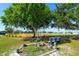 A vibrant community baseball field is surrounded by lush greenery and open spaces, perfect for outdoor activities and recreation at 6731 Washington Pl, Bradenton, FL 34207