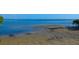 Scenic ocean view with wet sand visible in the foreground at 6731 Washington Pl, Bradenton, FL 34207