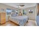 Bright bedroom with wood floors, a large window, and calming coastal decor at 6731 Washington Pl, Bradenton, FL 34207