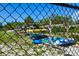 Canoes are neatly stacked and stored behind a chain-link fence in the community at 6731 Washington Pl, Bradenton, FL 34207