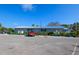 Exterior view of the Bayshore Gardens park clubhouse and parking lot at 6731 Washington Pl, Bradenton, FL 34207