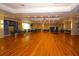 Expansive event hall with gleaming hardwood floors and celebratory decorations, perfect for large gatherings and special occasions at 6731 Washington Pl, Bradenton, FL 34207
