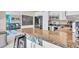 Kitchen with granite countertop, stainless appliances, and view of living room at 6731 Washington Pl, Bradenton, FL 34207