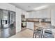 Modern kitchen with white cabinets, stainless steel appliances, and granite countertops at 6731 Washington Pl, Bradenton, FL 34207