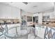 Bright kitchen with granite countertops, stainless appliances, and breakfast table at 6731 Washington Pl, Bradenton, FL 34207