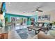 Bright living room with modern furnishings and a seamless flow to the outdoor pool area at 6731 Washington Pl, Bradenton, FL 34207