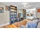 Open living space with hardwood floors, shelving, and views to dining and kitchen areas at 6731 Washington Pl, Bradenton, FL 34207