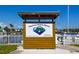 Sign for Bayshore Gardens Marina with website and phone number and view of boats in the marina at 6731 Washington Pl, Bradenton, FL 34207