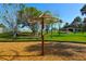 A shaded area in a park with a unique playground feature and open green spaces at 6731 Washington Pl, Bradenton, FL 34207