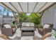 Inviting outdoor patio area with comfortable seating and a shaded pergola at 6731 Washington Pl, Bradenton, FL 34207