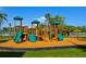 Playground with climbing structures, slides, and play areas in the sun at 6731 Washington Pl, Bradenton, FL 34207