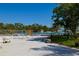 Inviting community pool area with ample seating and lush landscaping, providing a relaxing and enjoyable outdoor experience at 6731 Washington Pl, Bradenton, FL 34207