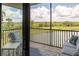 Scenic view from the balcony overlooking lush greenery and water features at 7005 River Hammock Dr # 303, Bradenton, FL 34212