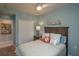 Comfortable bedroom featuring coastal decor, a cozy bed, and easy access to a closet for convenient storage at 7005 River Hammock Dr # 303, Bradenton, FL 34212