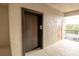 Hallway shot near an elevator with a glimpse of the building's exterior and natural light at 7005 River Hammock Dr # 303, Bradenton, FL 34212