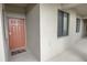 Condo entryway with a welcome mat, painted door, and exterior windows letting in natural light at 7005 River Hammock Dr # 303, Bradenton, FL 34212